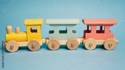 Colorful wooden toy train on blue background
