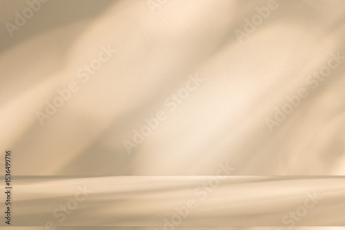 Wall interior background, studio and backdrops show products. with leaf shadow from window color beige and white. background for text insertion and presentation of product	
