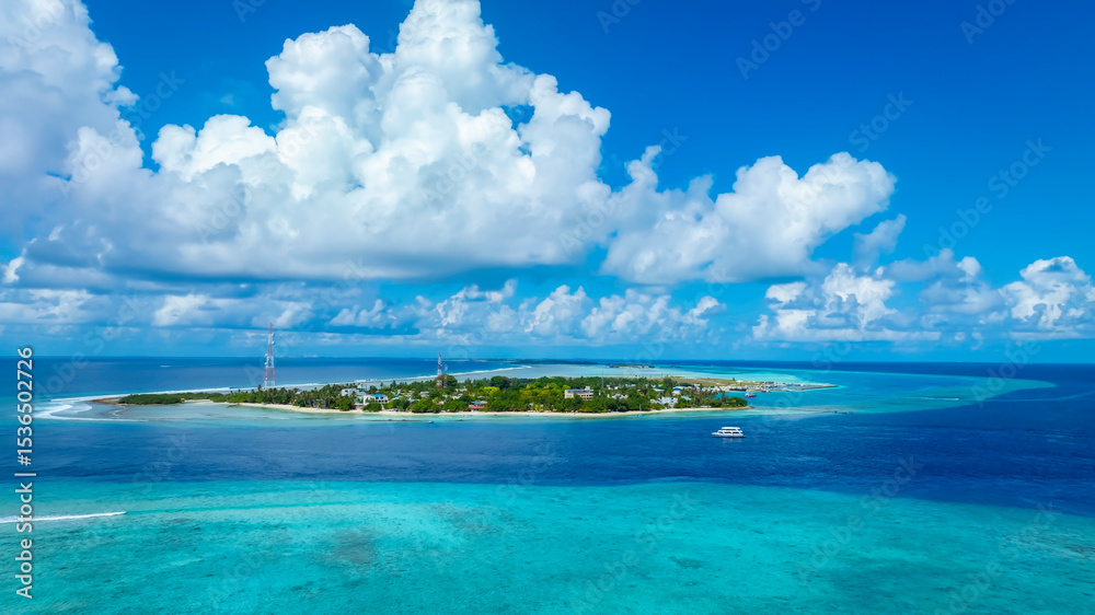Fototapeta premium The aerial view with cloud sky in the local village island with white sand beach as coastline in summer Maldives