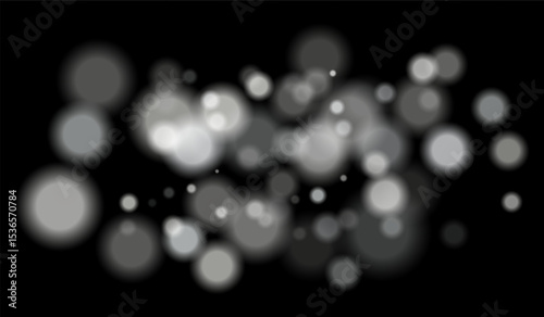 Multicolored blurred bokeh particles with violet, blue, pink hues floating on black background, creating festive or dreamy abstract composition.