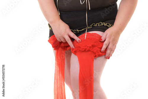 Woman plus size puts on red nylon stockings