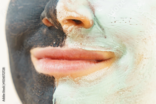 Girl black and green mud mask on face