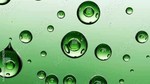Macro Photography Captures Vibrant Green Water Droplets Against A Gradient Background Showcasing