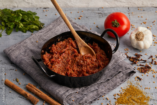 Fototapeta Naklejka Na Ścianę i Meble -  A rich and aromatic Indian tomato spice paste made with garlic, ginger, and traditional spices – used in curries, marinades, and Indian cooking.