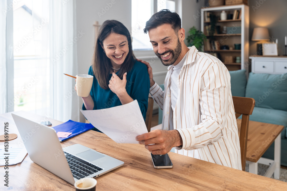 Obraz premium Finance and economy. Young couple, small business owners, working online at home office, preparing for video call for presentation and online coaching. E-commerce man and woman professional occupation