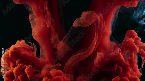 Abstract red ink swirling in water