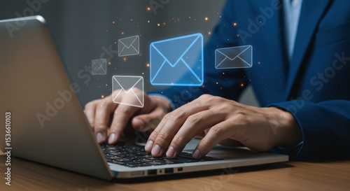 Hands typing on a laptop with email icons floating above the keyboard
