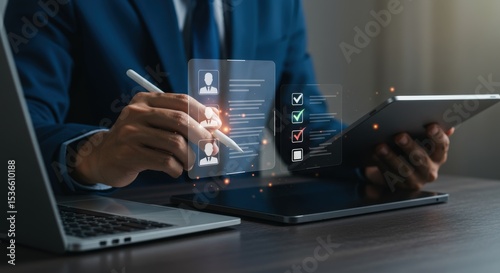 Businessman reviews candidate profiles and checklist on digital devices for recruitment process