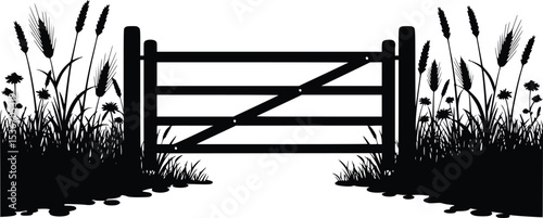 Silhouette of rustic wooden fence with tall grass and foliage in peaceful countryside setting
