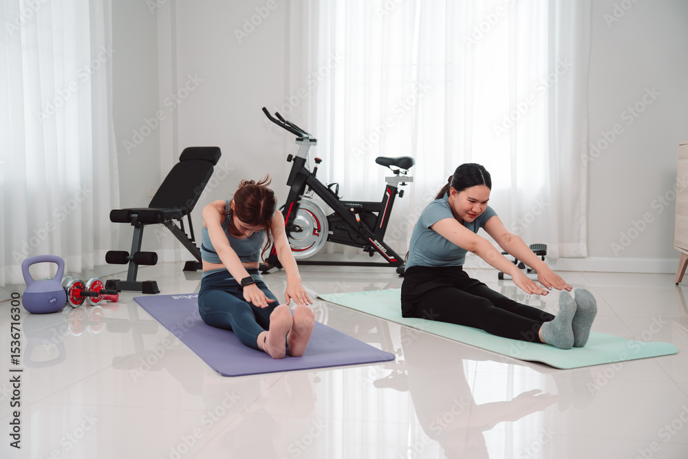Fototapeta premium Asian Woman Lifestyle Friends Training Fitness Sport Fit Exercise , Two Female Active Enjoying a Healthy Home Workout Routine Together for Wellness, Balance, and Motivation in the Living Room