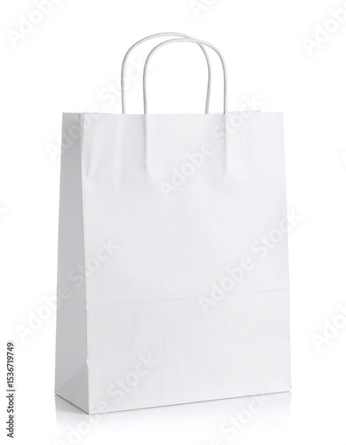 Isolated white paper shopping bag with handles on a white background, studio shot