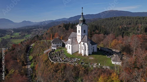 Aerial of Church of Sternberg (Pfarrkirche Sternberg St. Georg) at autumn in Carinthia, Austria. 2x speeded up from 30 fps.
