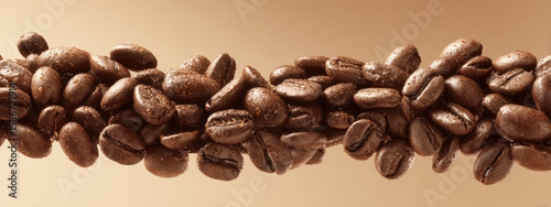 Freshly roasted coffee beans arranged in horizontal line, showcasing their rich texture and color, evoking sense of warmth and comfort