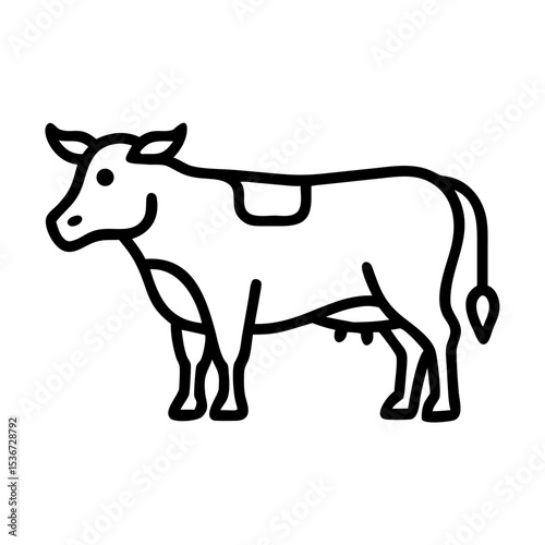 Cow standing in a grassy field during daylight, showcasing its calm demeanor and rural setting