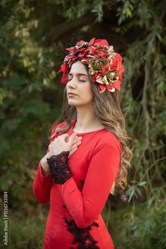 Young woman with flower headdress in nature