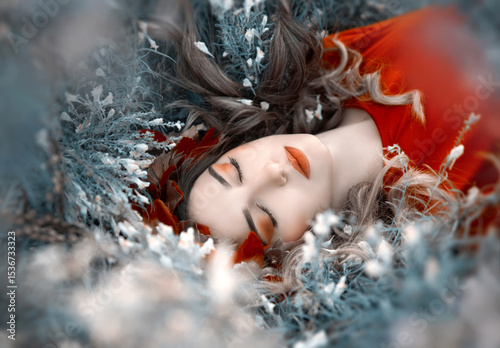 Portrait of a woman lying in the grass