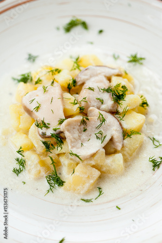 Potatoes with porcini mushrooms and dill on a plate