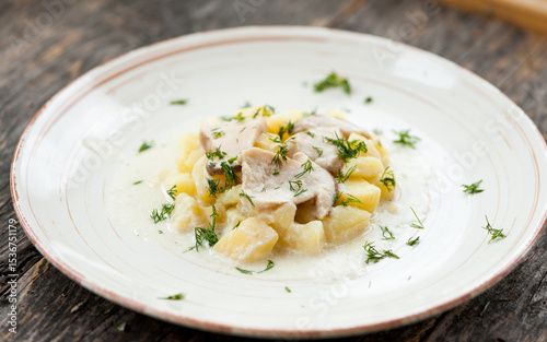 Potatoes with porcini mushrooms and dill on a plate