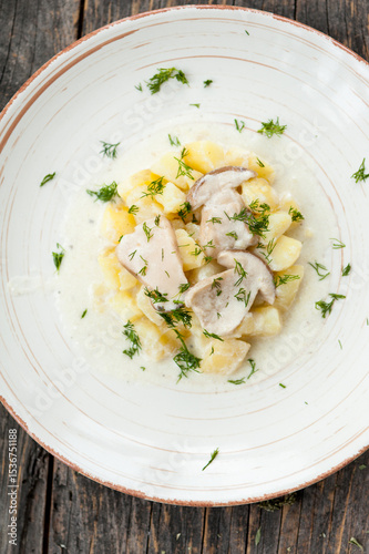 Potatoes with porcini mushrooms and dill on a plate