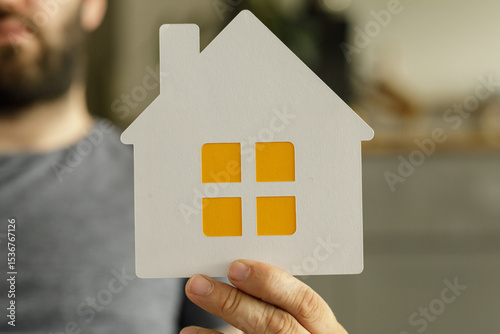 Close up of a man holding a...