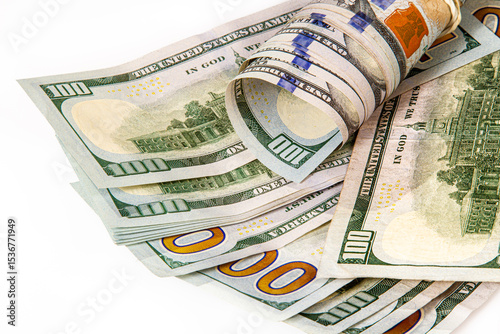 A stack of US 100 bills on a white background.  Synonymous with wealth and abundance.