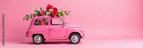 Pink vehicle with floral gift atop, against pink background, holiday, roof