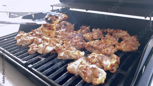 Juicy Chicken Thighs Being Grilled to Perfection on a Small Weber Grill