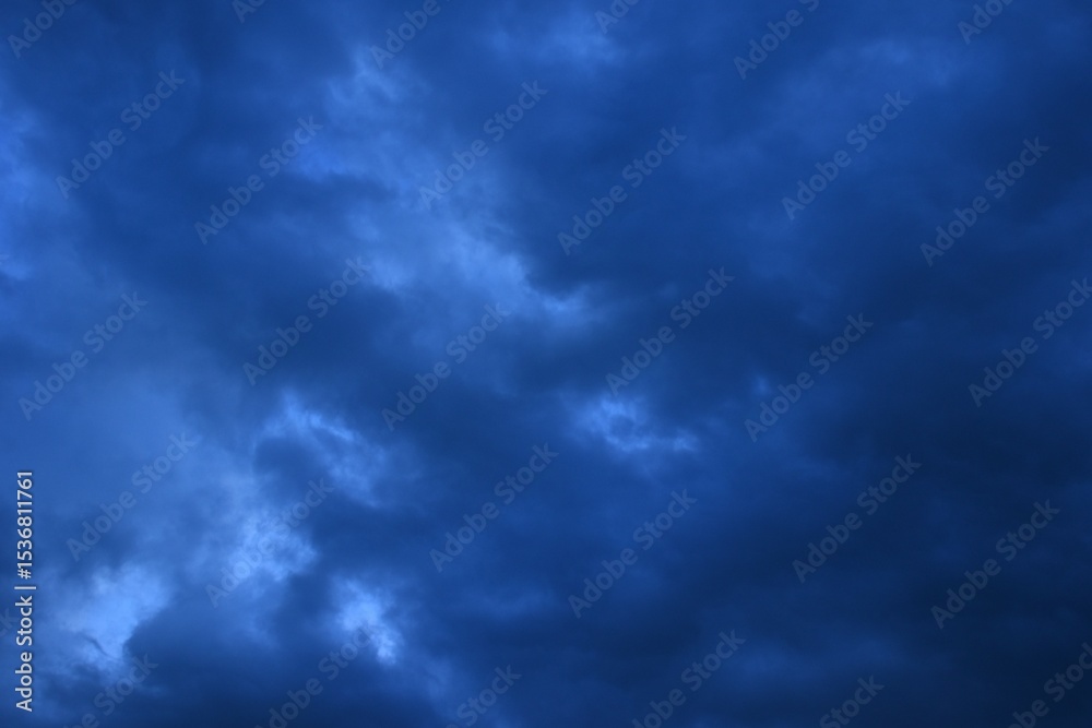 Fototapeta premium dark rain cloud floating on sky at sunset in evening