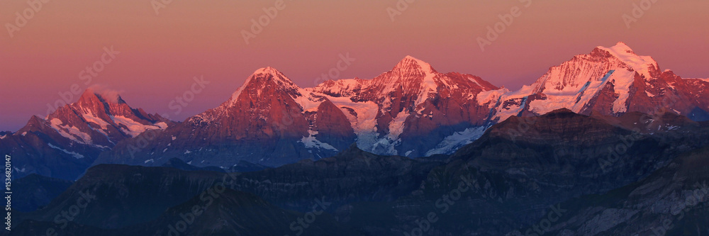 Obraz premium Eiger, Monch and Jungfrau in pink evening light, Switzerland.