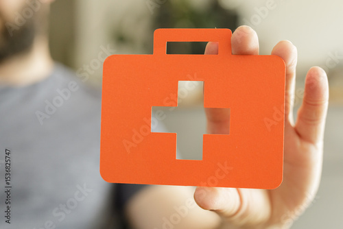 Image of a hand holding a p...