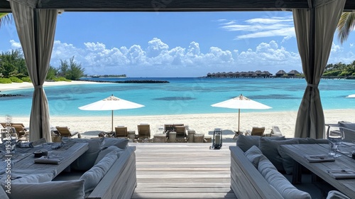 Tropical beach scene with luxury seating and dining area.