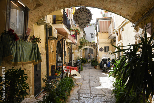People walking on the alley of Bari on Italy