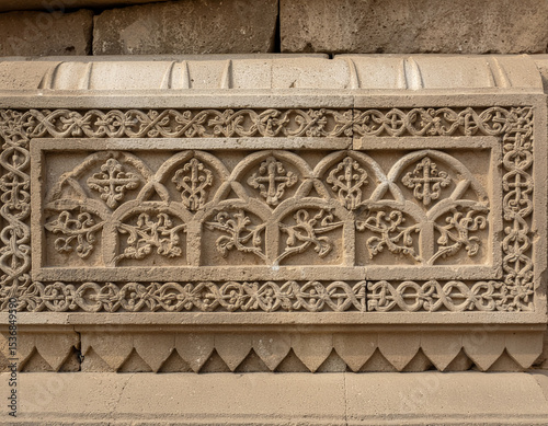 Intricate Stone Carving on Historical Architectural Wall