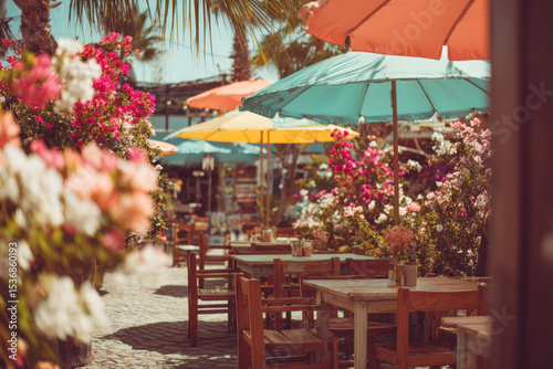 Outdoor cafe scene with colorful umbrellas and blooming flowers creating a vibrant atmosphere