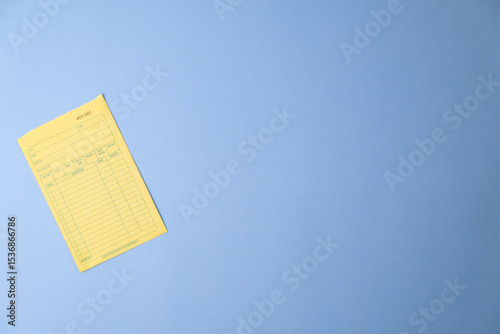 Yellow, blank sales receipt invoice page on a blue background.