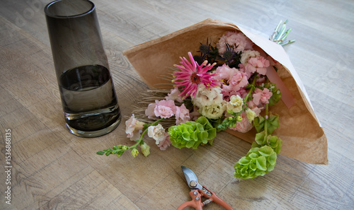 Floral Bouquet Preparation with Shears on Wooden Floor