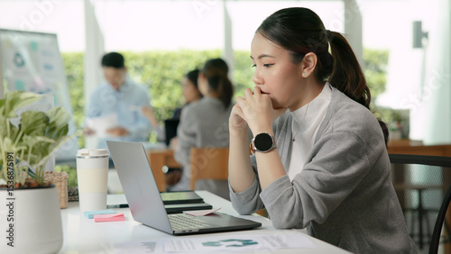 Asia people young adult woman bad day work hard bored data tired at office desk workplace think worry job tough stress asian workforce issue. Mid life crisis mental health illness sad labor effort.