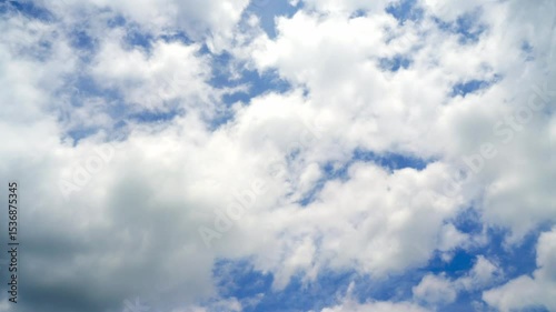 Timelapse of clouds and blue sunny sky,  white clouds over blue sky, Aerial view,  nature, blue sky, white clear weather.