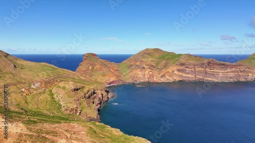 Discover the breathtaking coastal landscapes of Madeira with vibrant colors and striking cliffs under a clear blue sky
