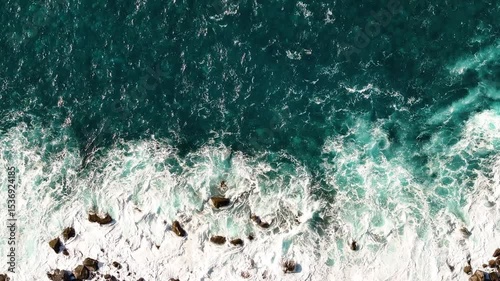 Discovering the breathtaking coastal beauty of Madeira with crashing waves and vibrant blue waters