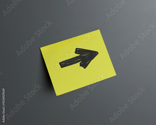 Bright yellow sticky note with arrow pointing right