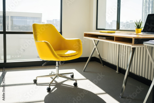 A single yellow chair placed in front of a window, possibly for reading or relaxation