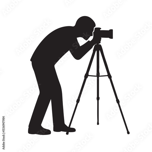 Silhouette of Photographer Taking Picture with Camera on Tripod