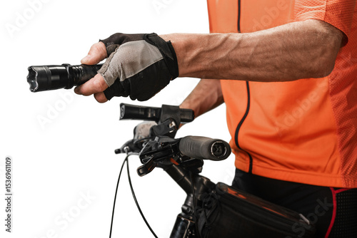 Closeup of professional sportsman using stun gun for self defense during bicycle ride. Cyclist with dog deterrent equipment, ensuring protection from potential attacks during outdoor ride.