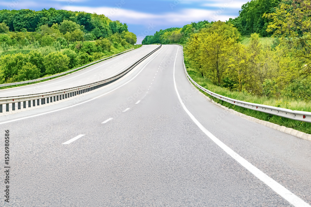 Fototapeta premium Empty rural highway mountain road goes up at high trees.Scenic abstract forest roadway nature landscape.European travel vacation car concept.