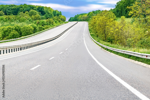Empty rural highway mountain road goes up at high trees.Scenic abstract forest roadway nature landscape.European travel vacation car concept.