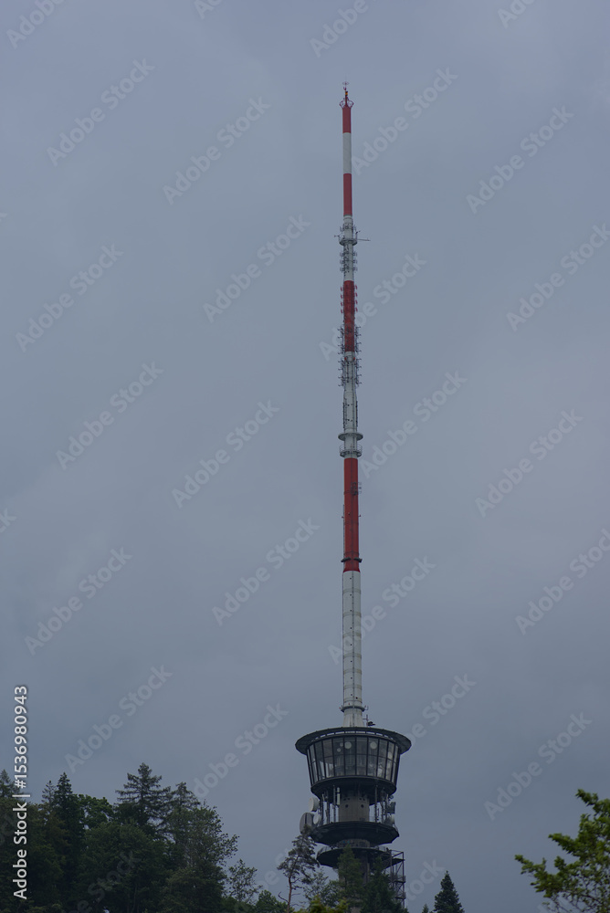Iconic towering antenna against a soft sky, a symbol of communication and modern infrastructure. Striking vertical composition. Iconic towering antenna against a soft sky, a symbol of communication and modern infrastructure. Striking vertical composition.