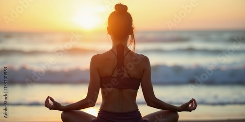 Woman Meditating at Sunset on Beach