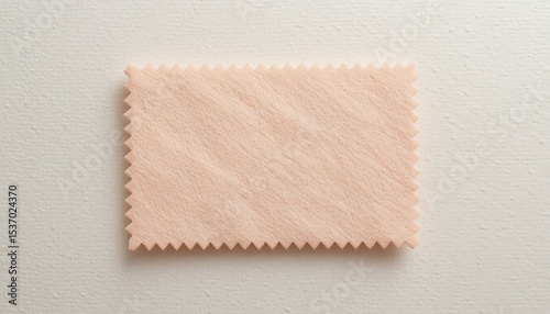 Peach colored fabric swatch sample on white background