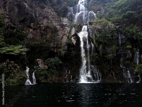 waterfall and pond of Bassin des Aigrettes, Saint Gilles, Reunion island. Scenic tropical cascade background in la Réunion 